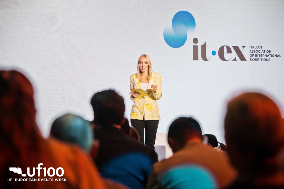 Chloe on stage at UFI European Events Week, it-ex