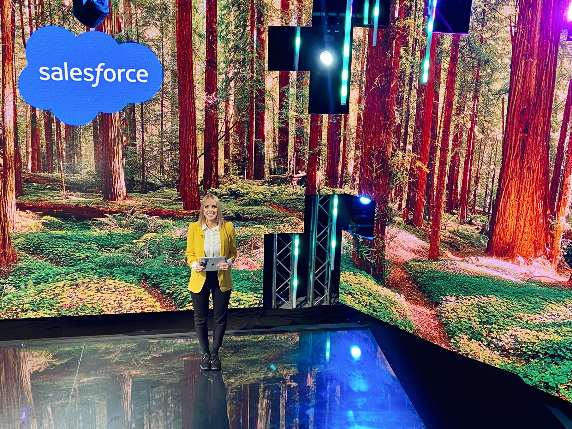 Chloe Richardson on stage hosting a Salesforce event